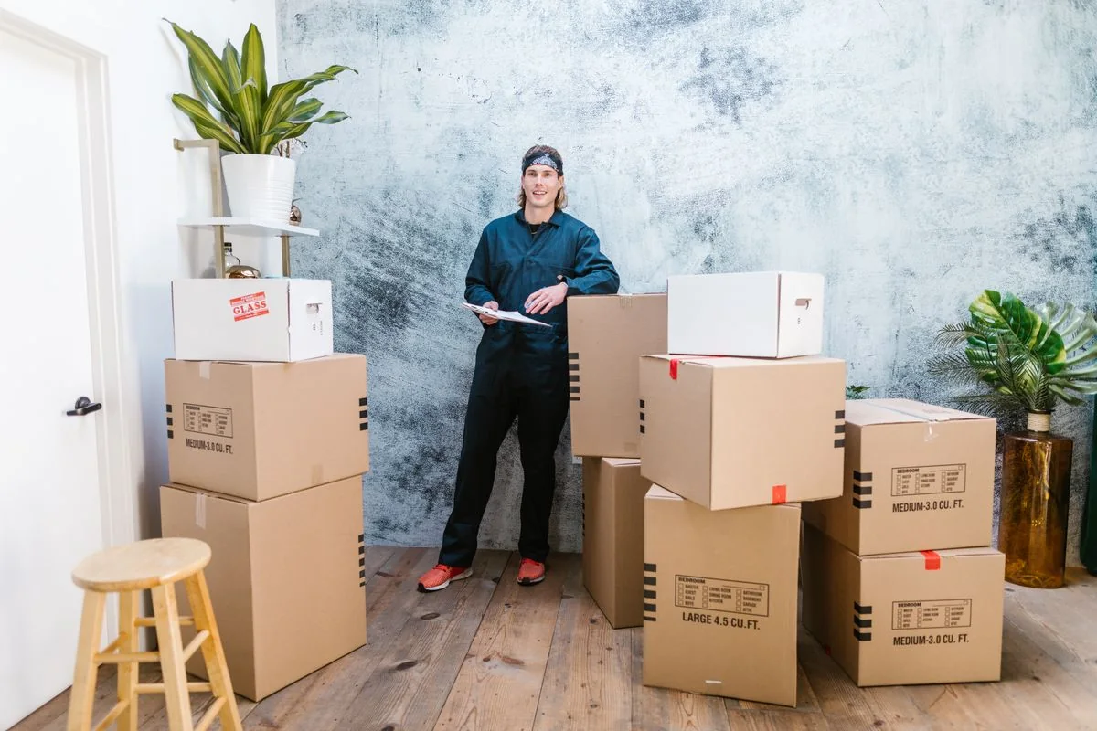 Illustrative mover coordinating labelled household boxes