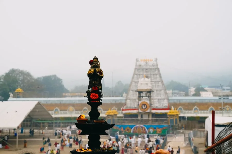 Temple architecture and traditional lamp in Tirupati